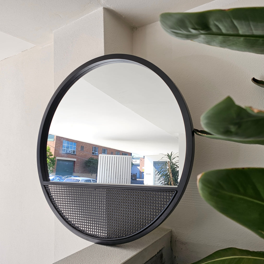 Boho 100cm round wall mirror with a natural rattan frame