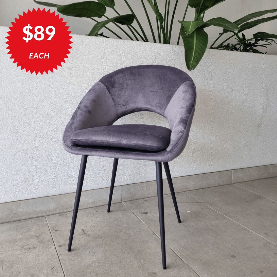 Wilson dining chair in grey velvet with a curved back