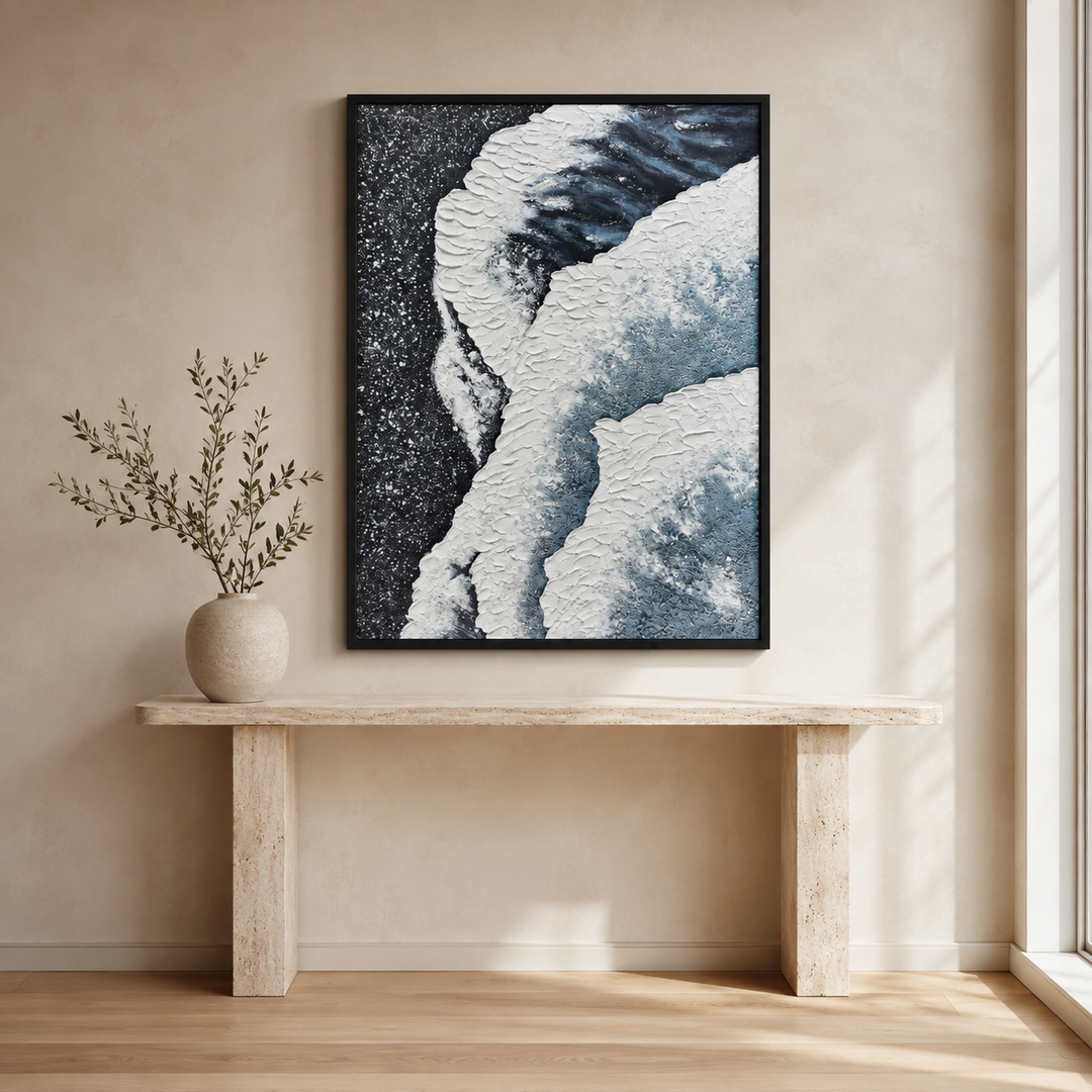 Tide coastal wall art, hand-finished micro-plaster canvas in steel blue, slate grey and white, portrait, above a travertine console