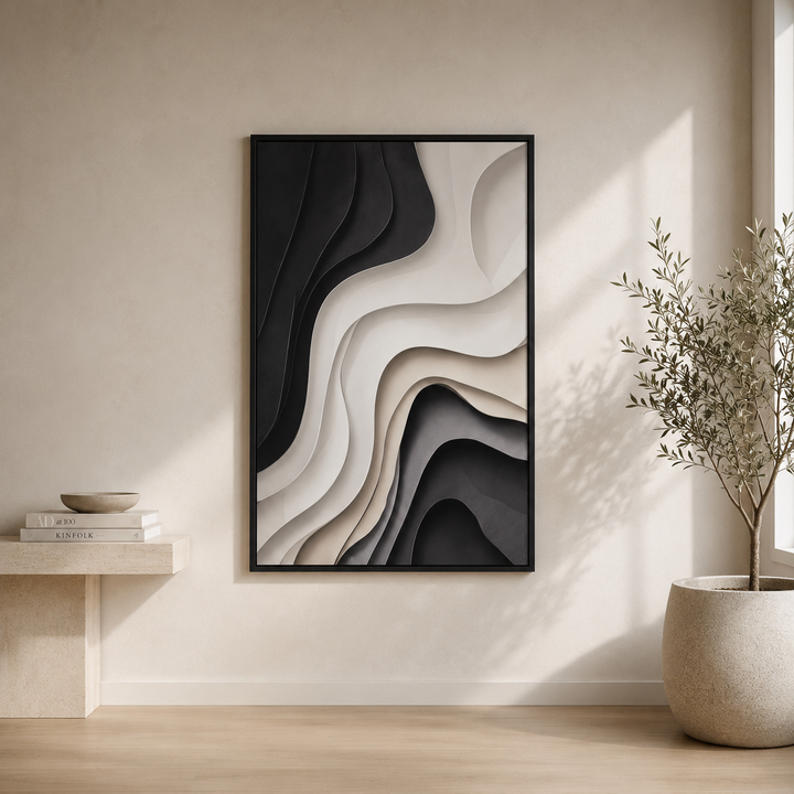 Strata wall art in a black frame, high contrast black and cream curved bands, styled above a travertine bench