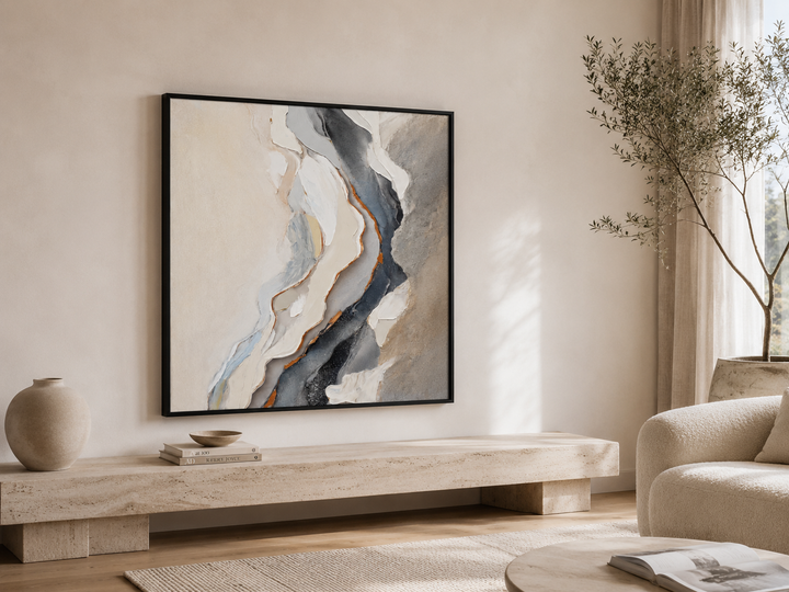 Chalk textured wall art, hand-finished cream and beige canvas with raised paint in a black frame, on a warm neutral wall