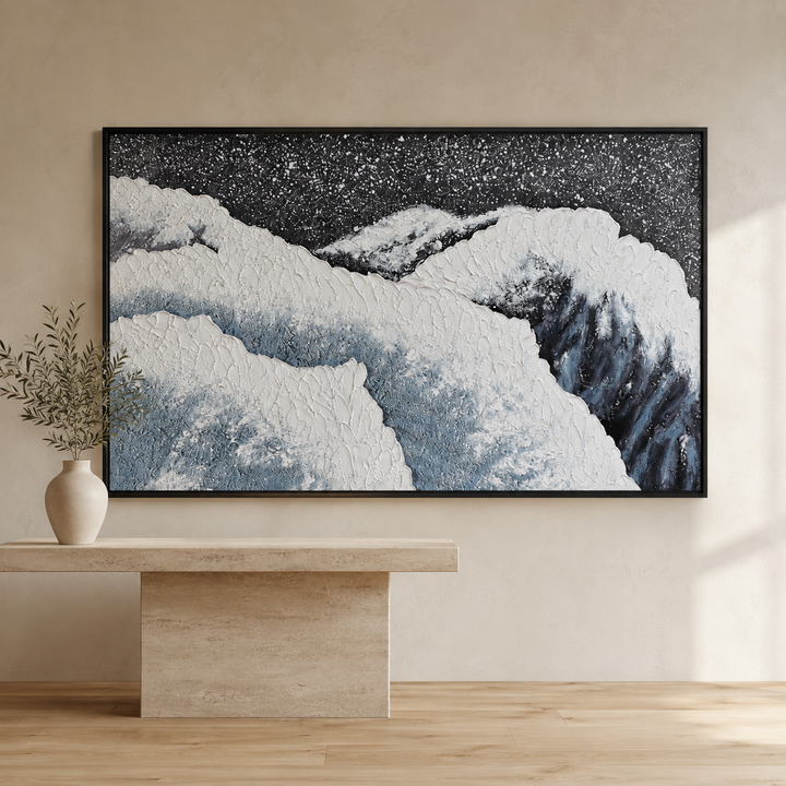 Tide blue and grey 3D coastal wall art in a black frame, raised white plaster surf over slate blue water