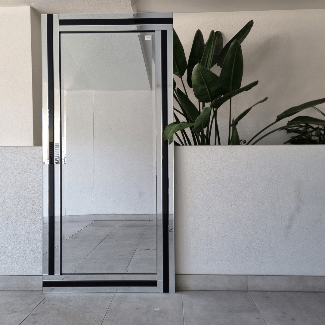 Miranda wall mirror with smoked grey tinted glass and a thin black frame